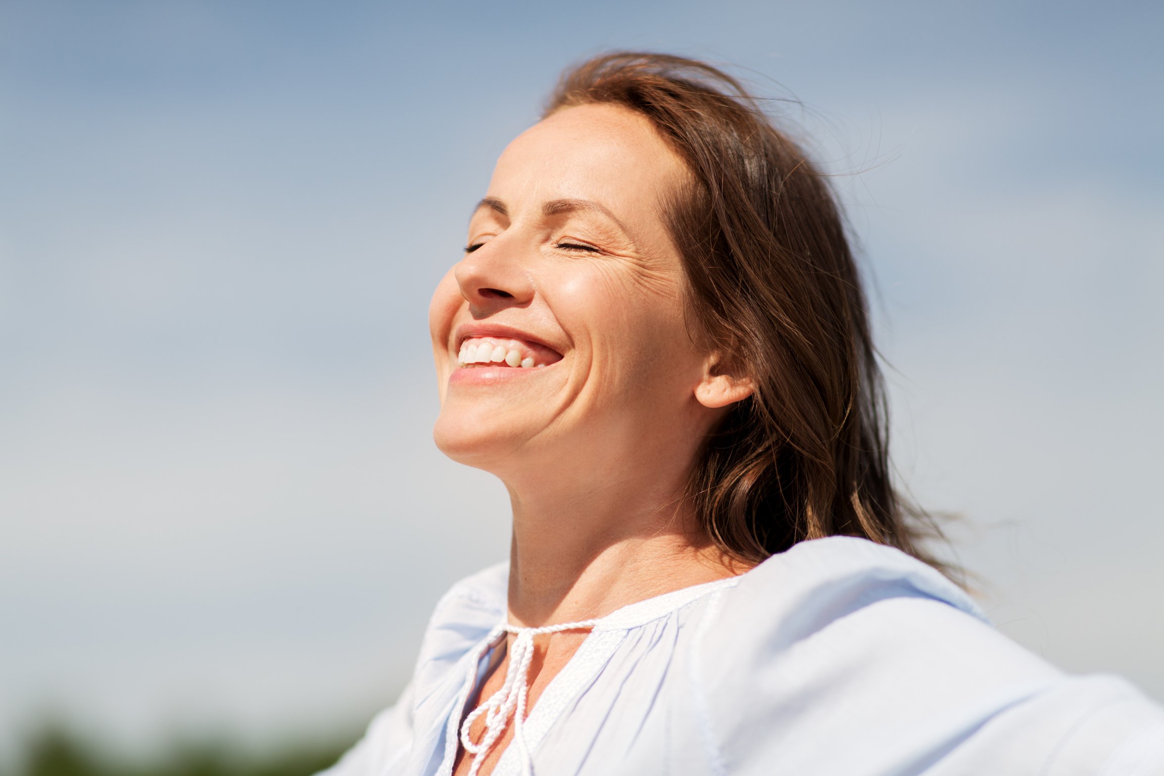 Happy Mature Woman Enjoying Sun